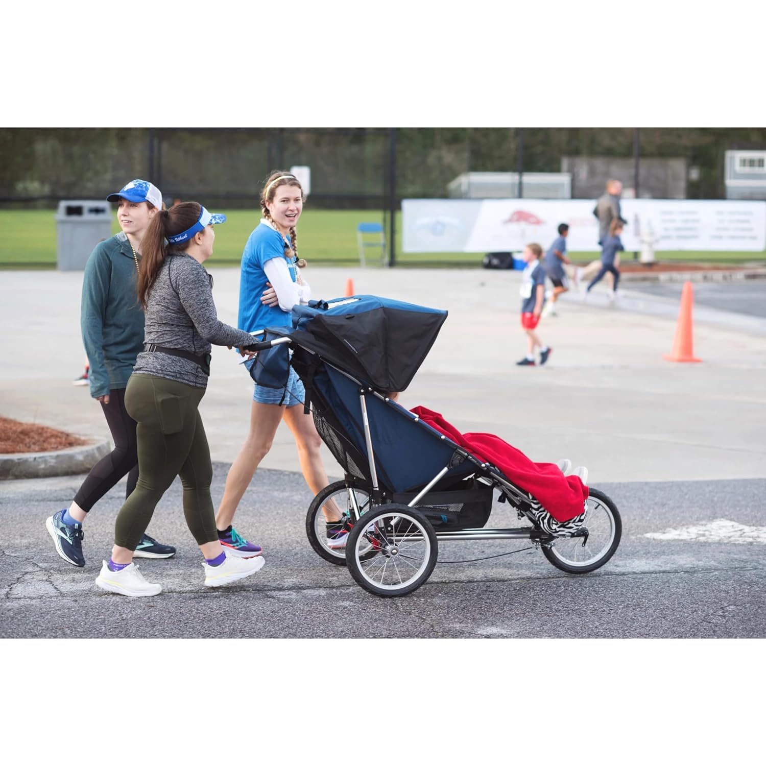 Modern jogging stroller with black frame and gray fabric seat, three all-terrain wheels for parent mobility — view 5