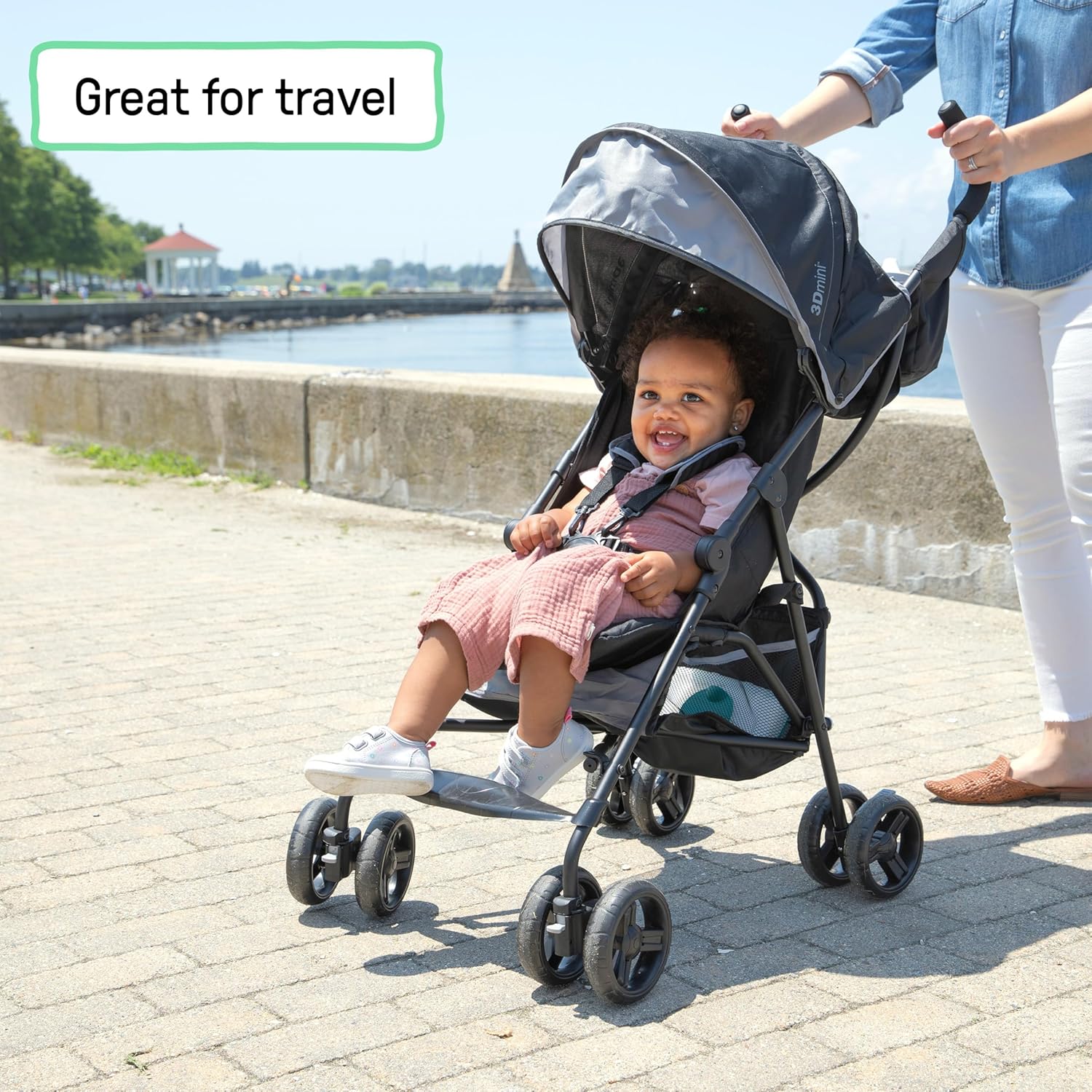 Gray lightweight umbrella stroller with compact fold and extended sun visor canopy — side