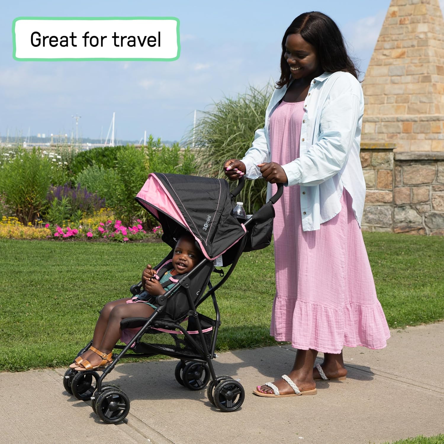 Pink lightweight umbrella stroller with compact fold and pop-out sun visor for travel โ view 2