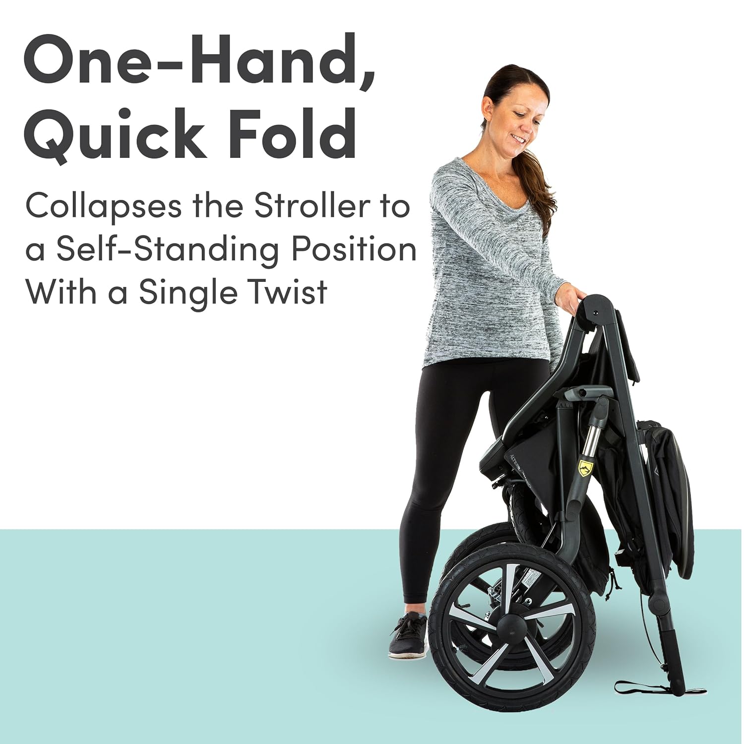 Alterrain Pro jogging stroller in black with SmoothShox suspension system, front swivel wheel visible — view 2