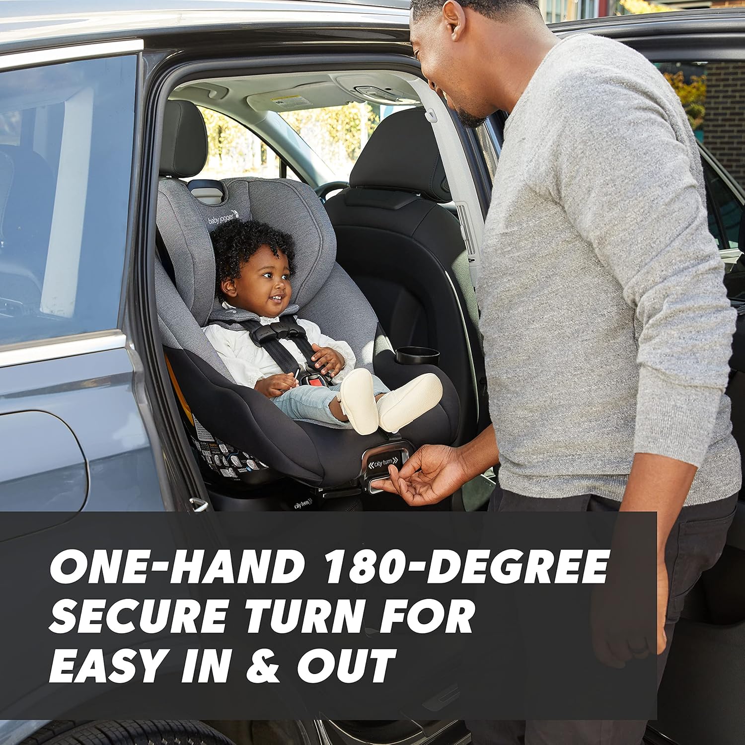 Rotating car seat with 180-degree swivel mechanism in pike fashion design, showing COOLMAX fabric and rear-facing position — side