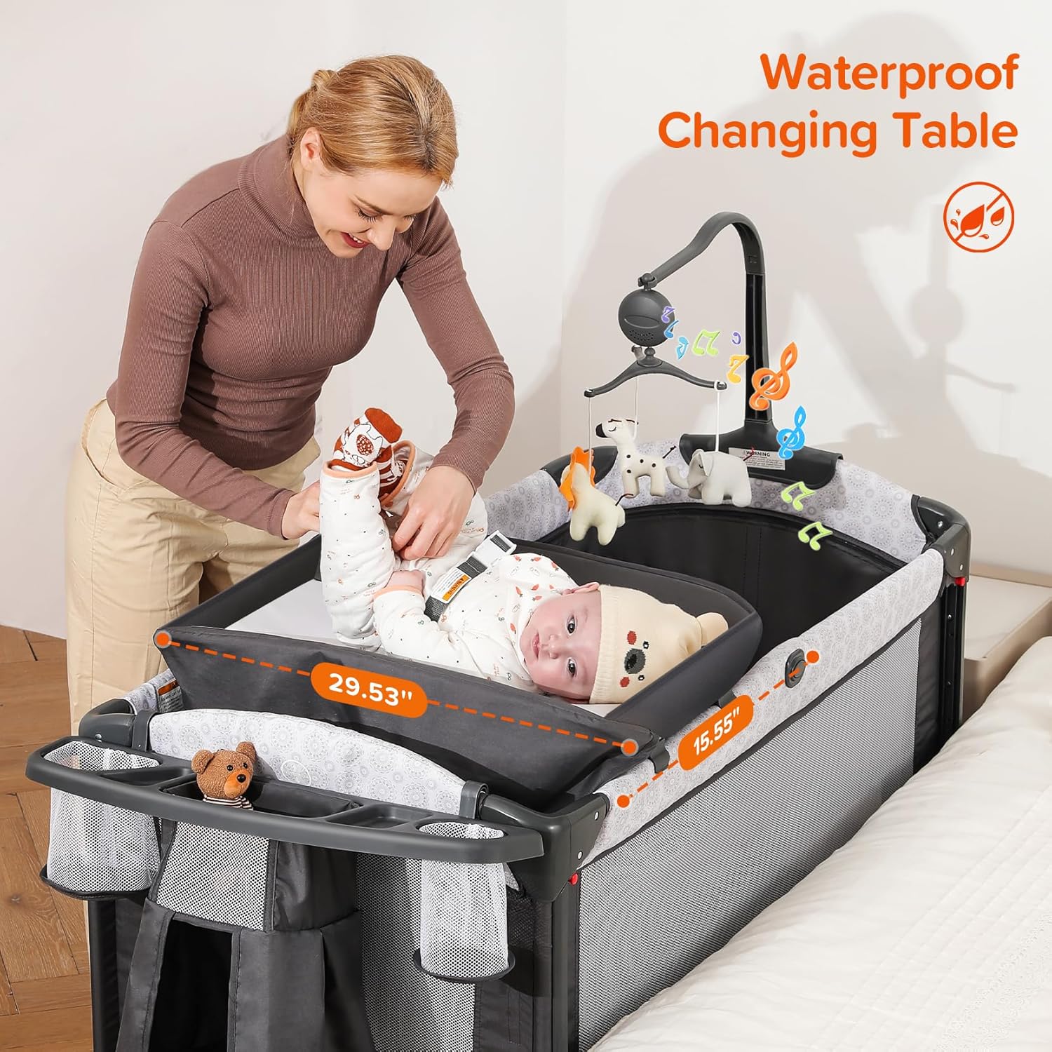 Modern gray 4-in-1 bedside bassinet with integrated diaper changing station, adjustable mattress height, and storage compartment — view 2