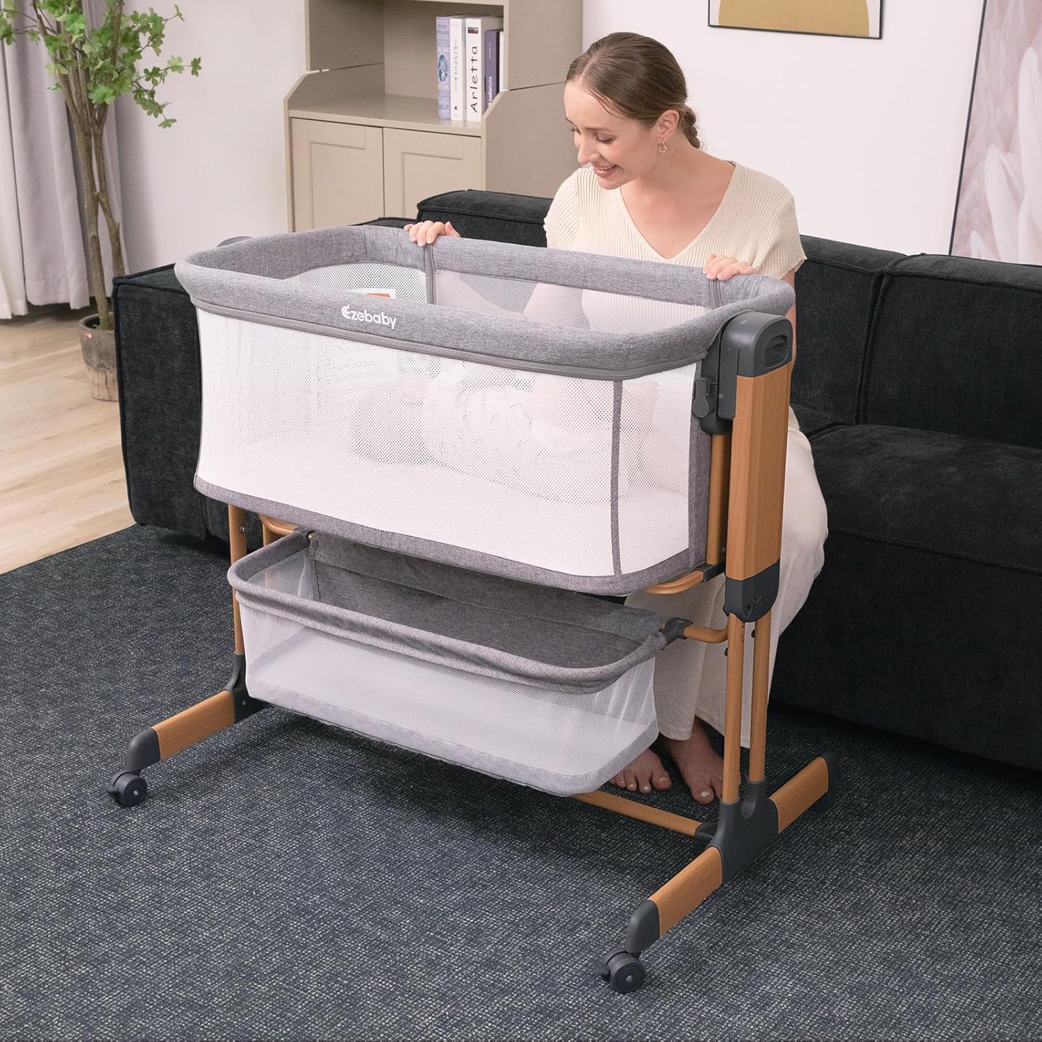 Modern 3-in-1 white bassinet with mesh sides, wheels, and adjustable height for bedside sleeping — view 4