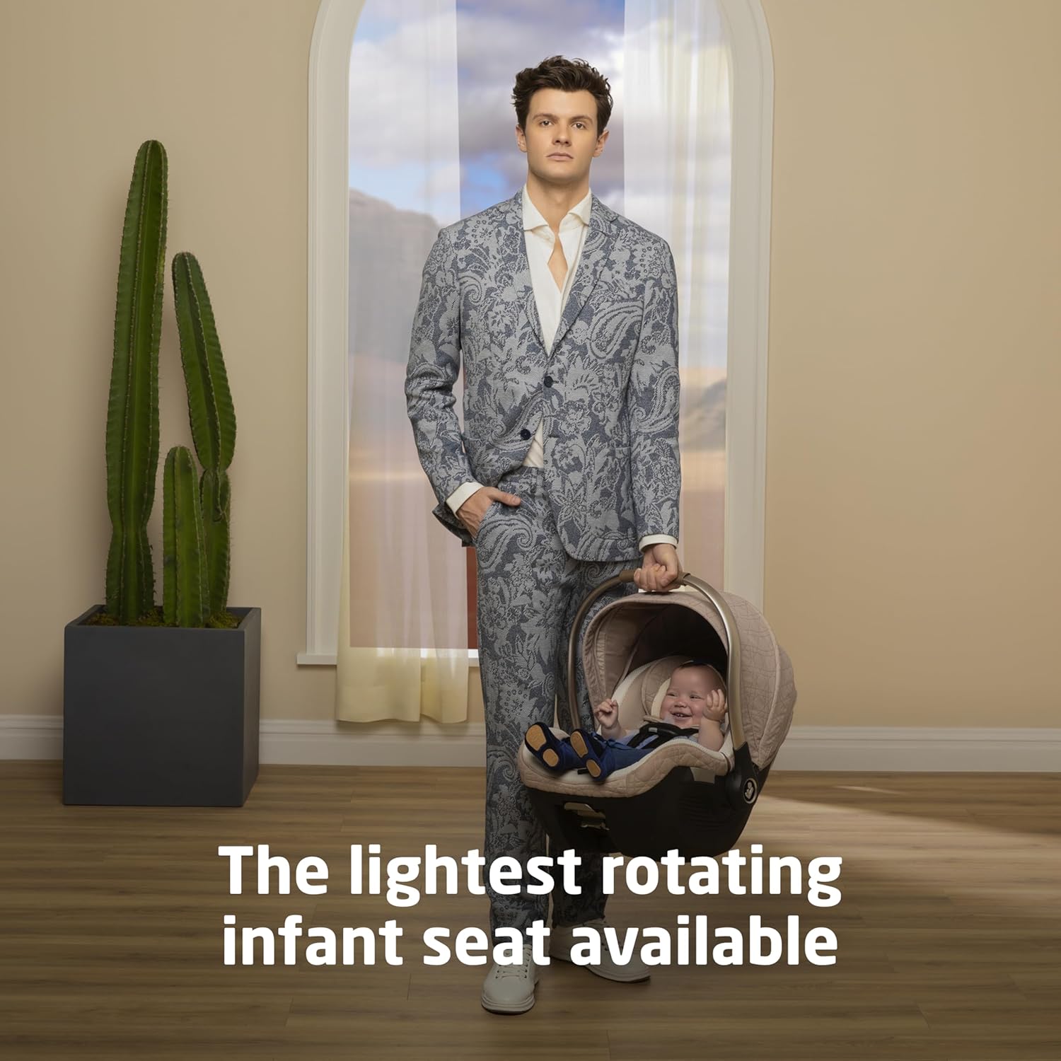 Maxi-Cosi Peri 180° rotating infant car seat in natural heritage color, shown with 180-degree swivel base — view 2