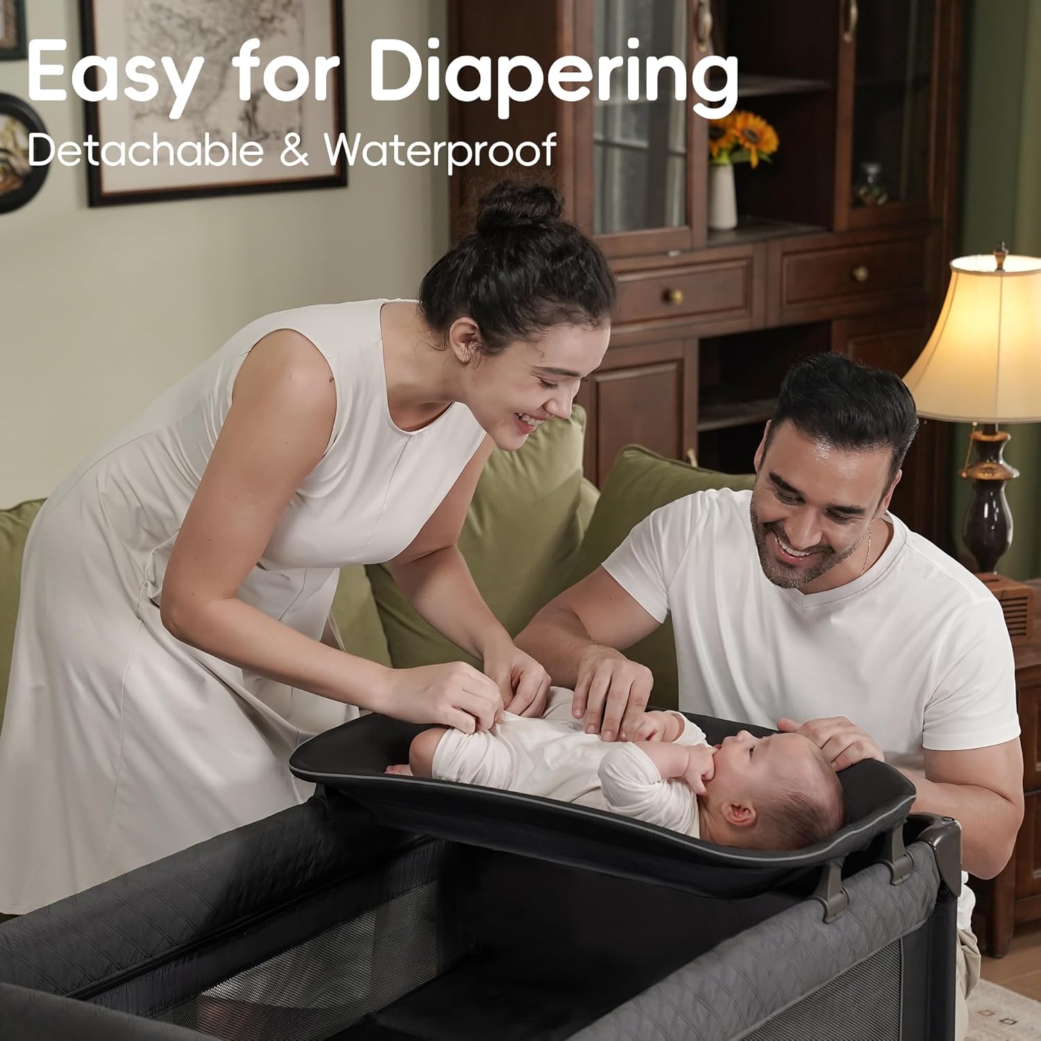 Modern foldable playard with gray fabric, integrated bassinet and changing table, featuring one-step folding mechanism and zip door access — view 3