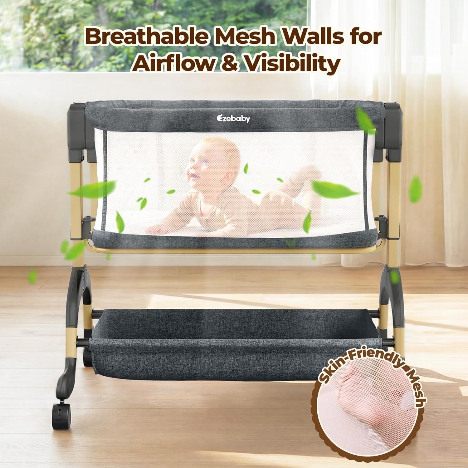 Modern 3-in-1 bassinet with full mesh sides, gray fabric, adjustable height mechanism, and lockable wheel base — side