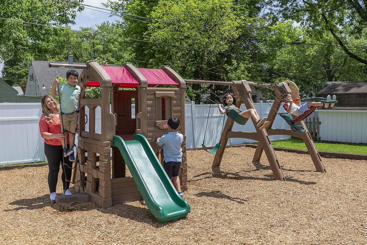 Step2 Naturally Playful Adventure Lodge outdoor playset with tan and brown panels, featuring integrated slide, swings, rope ladder, and basketball hoop for children ages 3-8 — view 2