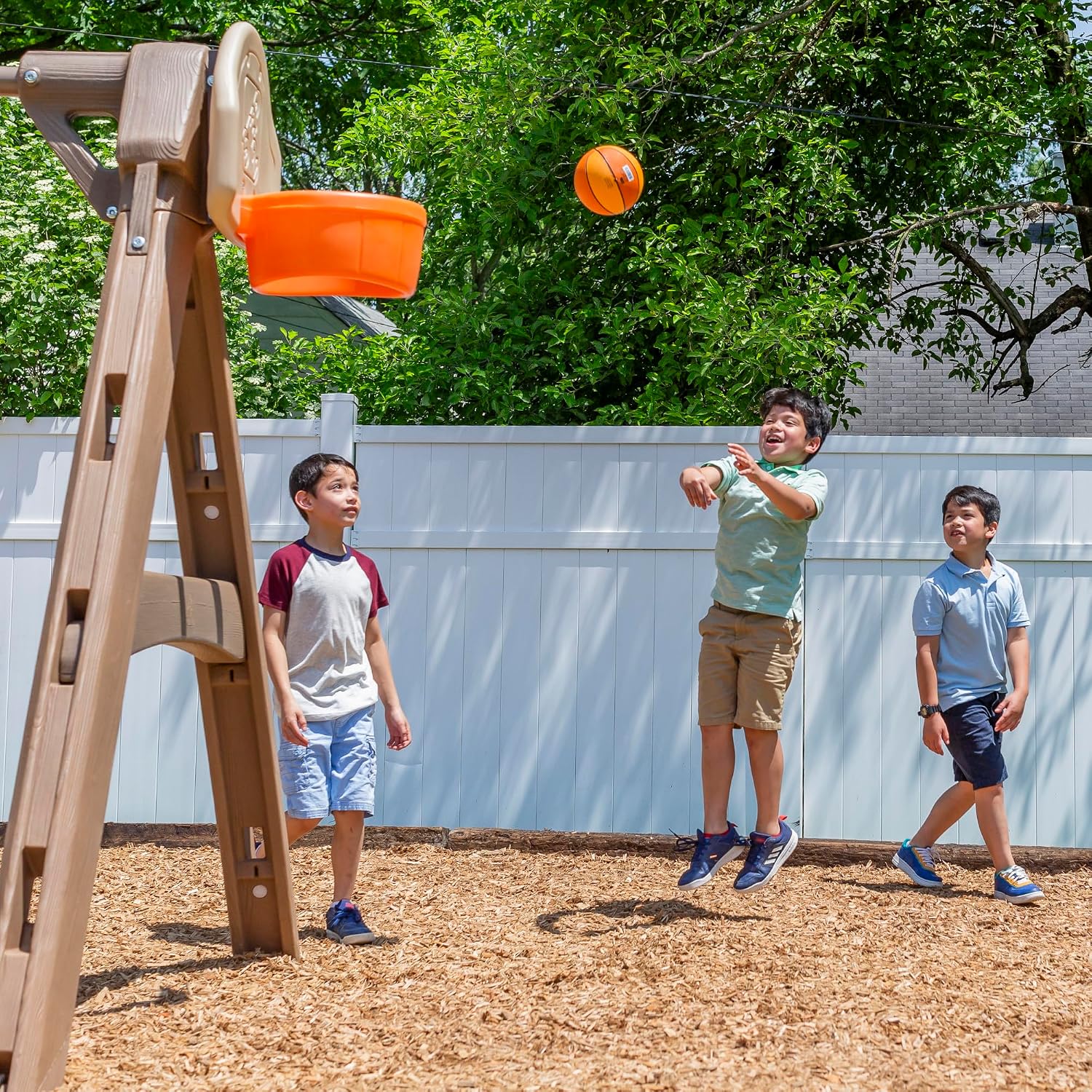 Step2 Naturally Playful Adventure Lodge outdoor playset with tan and brown panels, featuring integrated slide, swings, rope ladder, and basketball hoop for children ages 3-8 — view 2