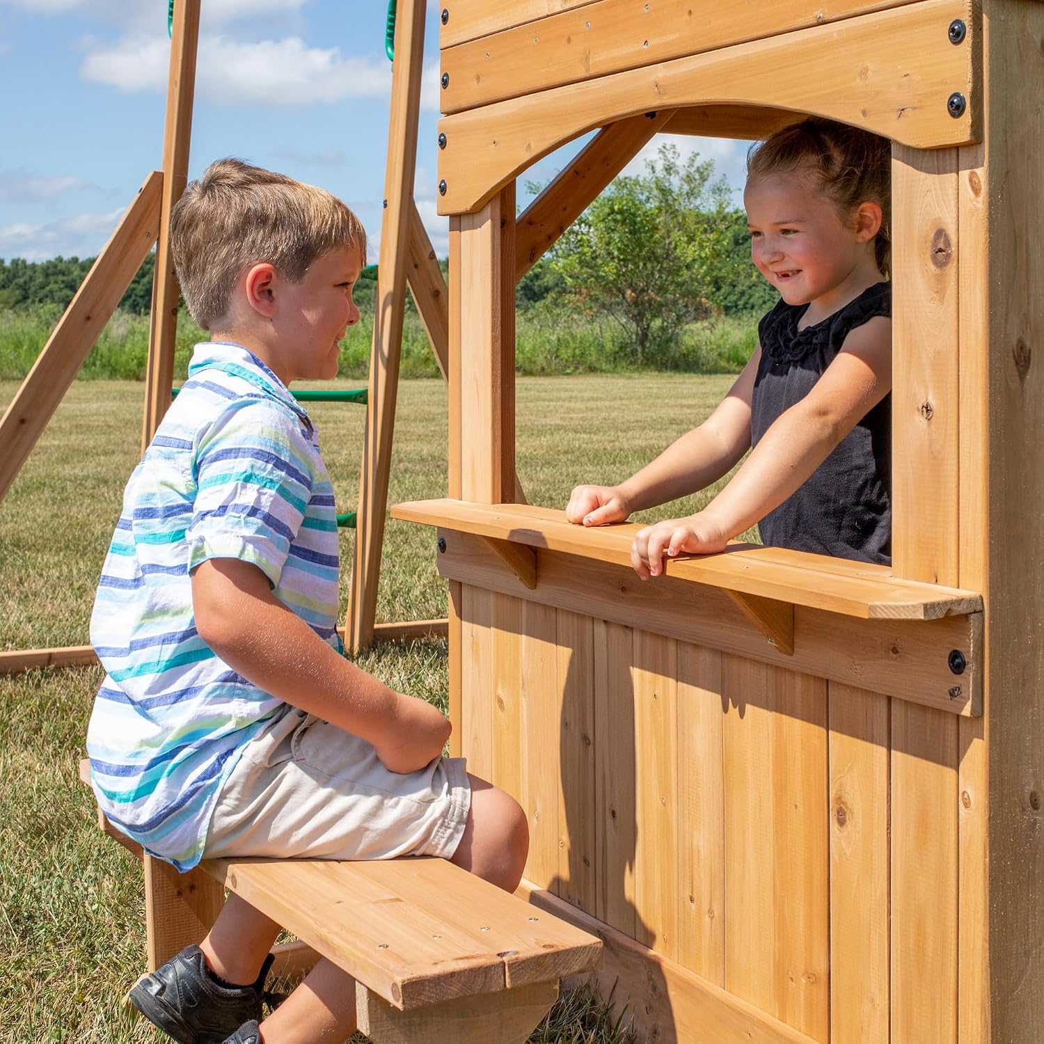 Cedar wood swing set with attached wave slide, clubhouse with working door, monkey bars, and dual belt swings — view 3
