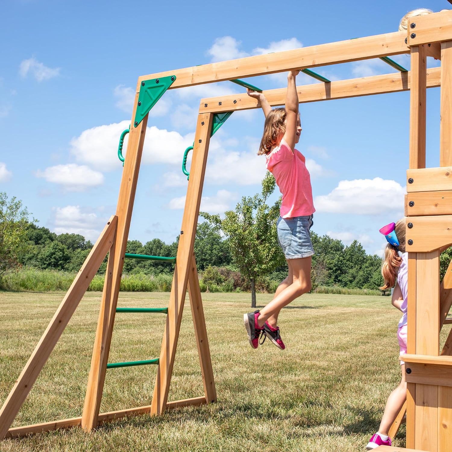 Cedar wood swing set with attached wave slide, clubhouse with working door, monkey bars, and dual belt swings — view 4