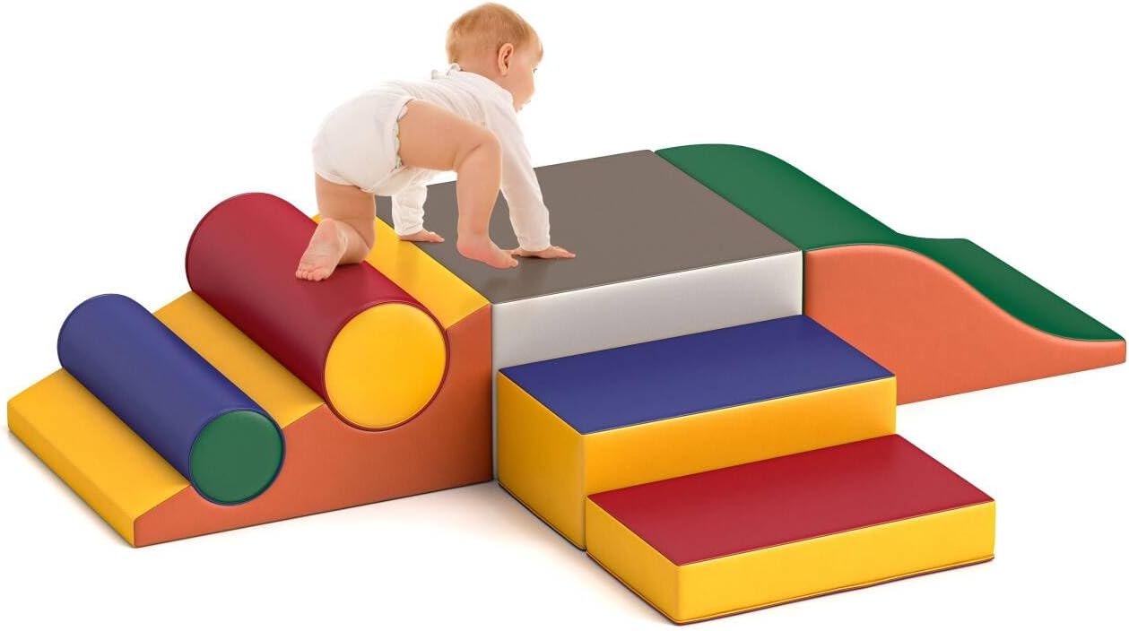 Seven soft foam climbing blocks in primary colors stacked and arranged for toddler play, featuring safe rounded edges for indoor climbing and sliding — view 1
