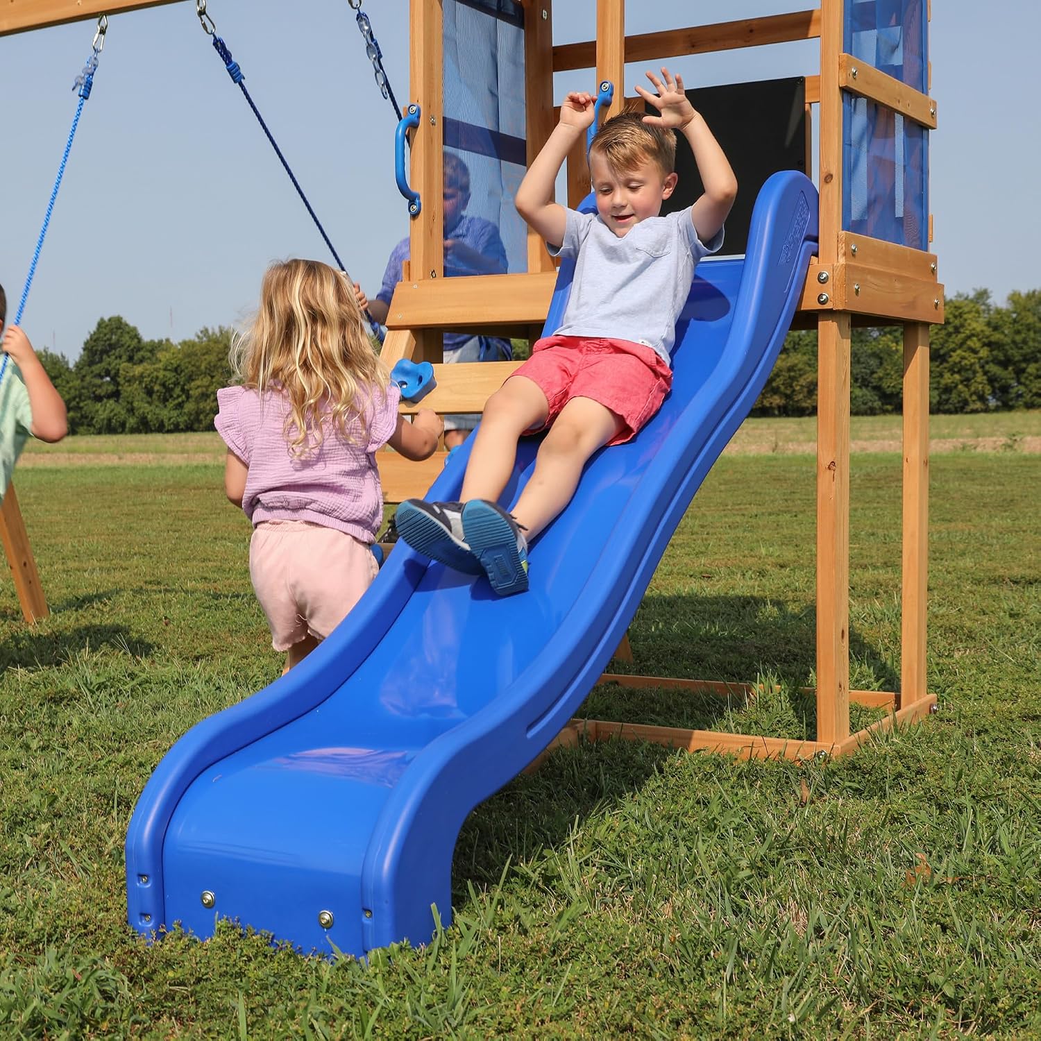 Cedar wood swing set with wave slide, tan canopy roof, and rock wall ladder for toddlers and preschoolers — view 2