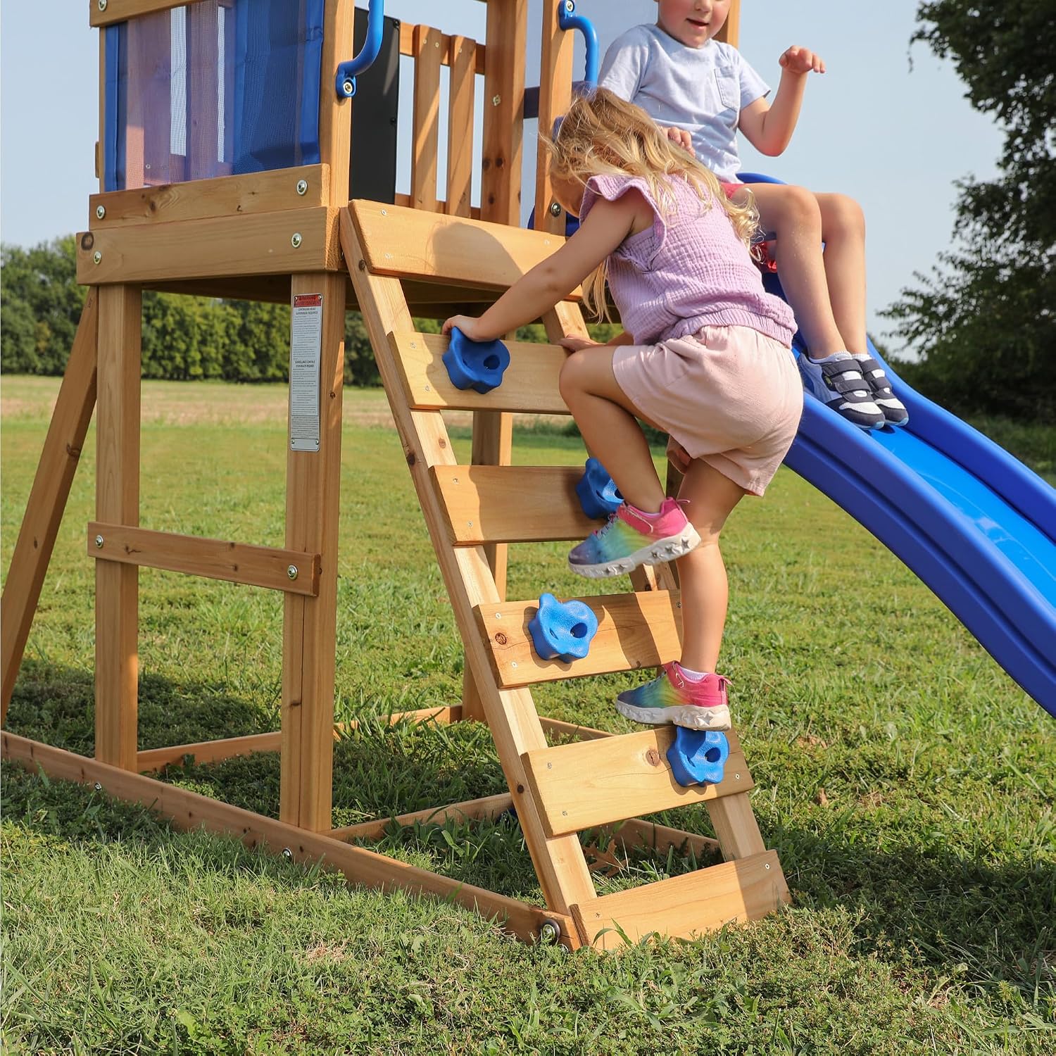 Cedar wood swing set with wave slide, tan canopy roof, and rock wall ladder for toddlers and preschoolers — view 3