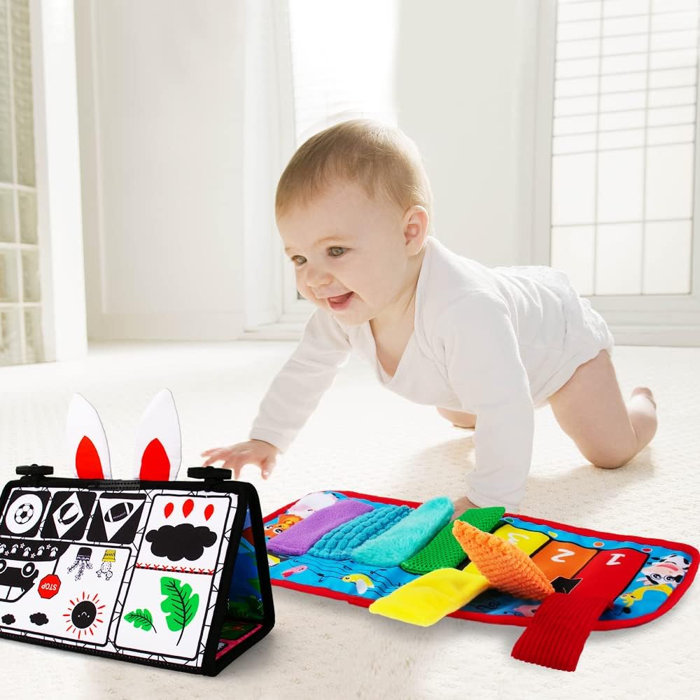 Black and white high contrast baby mirror toy with textured surfaces and squeaker for tummy time, mounted on tabletop for newborn sensory play — view 4
