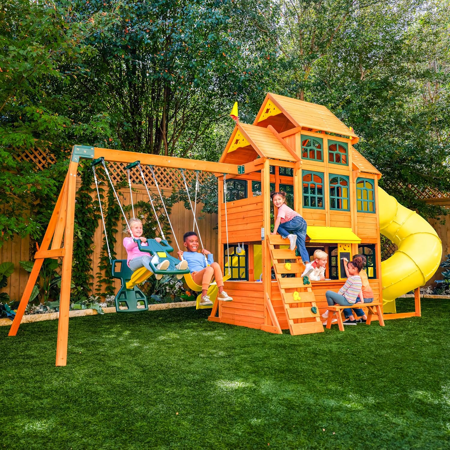 Wooden outdoor swing set with three slides, climbing wall, glider, and integrated play kitchen with cafe window for preschoolers — view 4