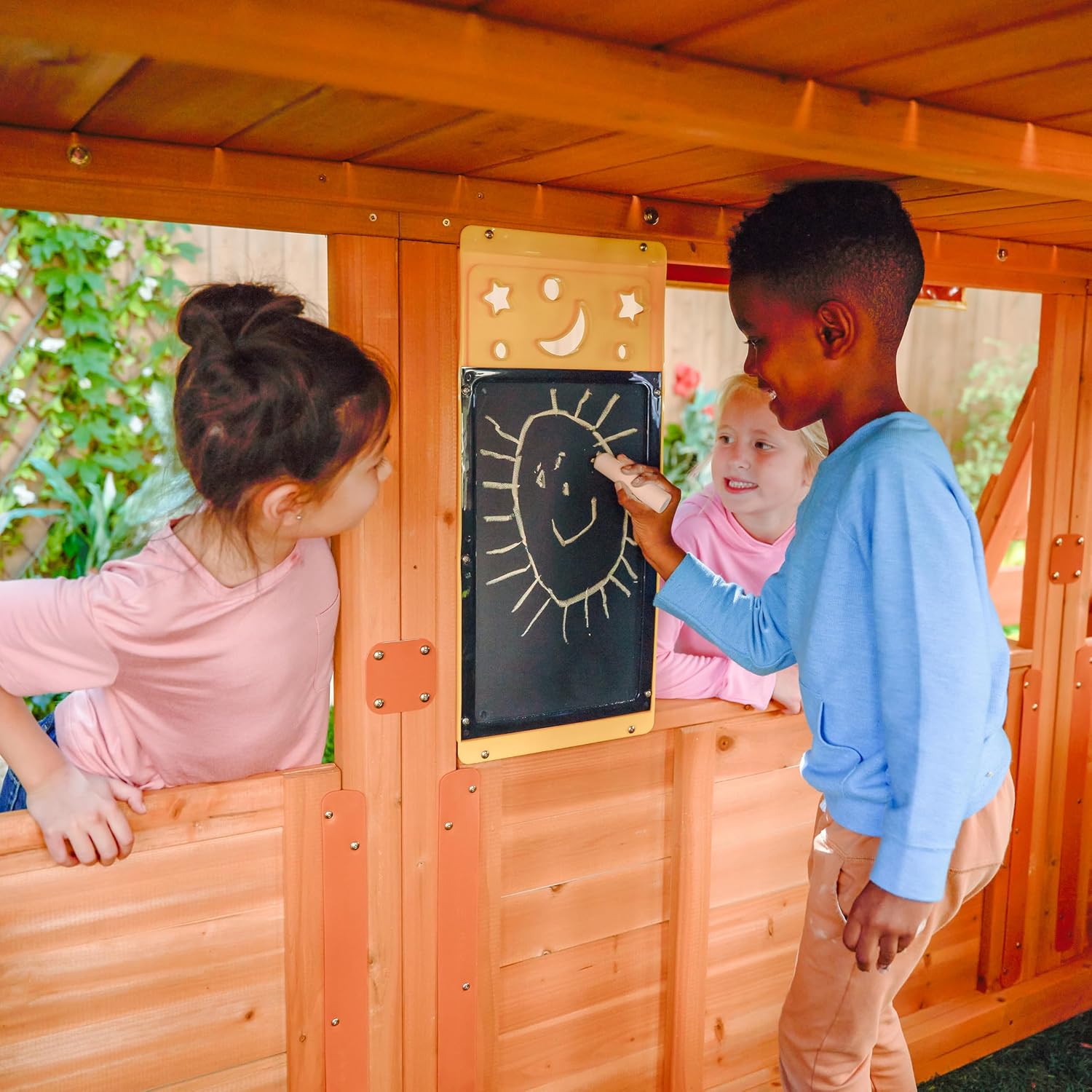 Wooden outdoor swing set with three slides, climbing wall, glider, and integrated play kitchen with cafe window for preschoolers — view 4
