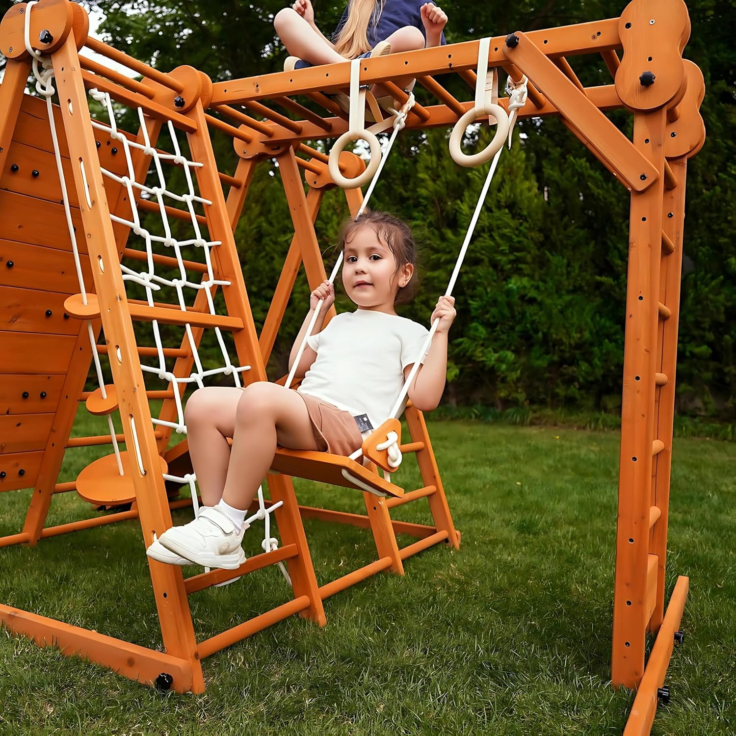 Natural wood 8-in-1 playset with slide, monkey bars, two swings, rock climbing wall, and gym rings for toddlers — view 2