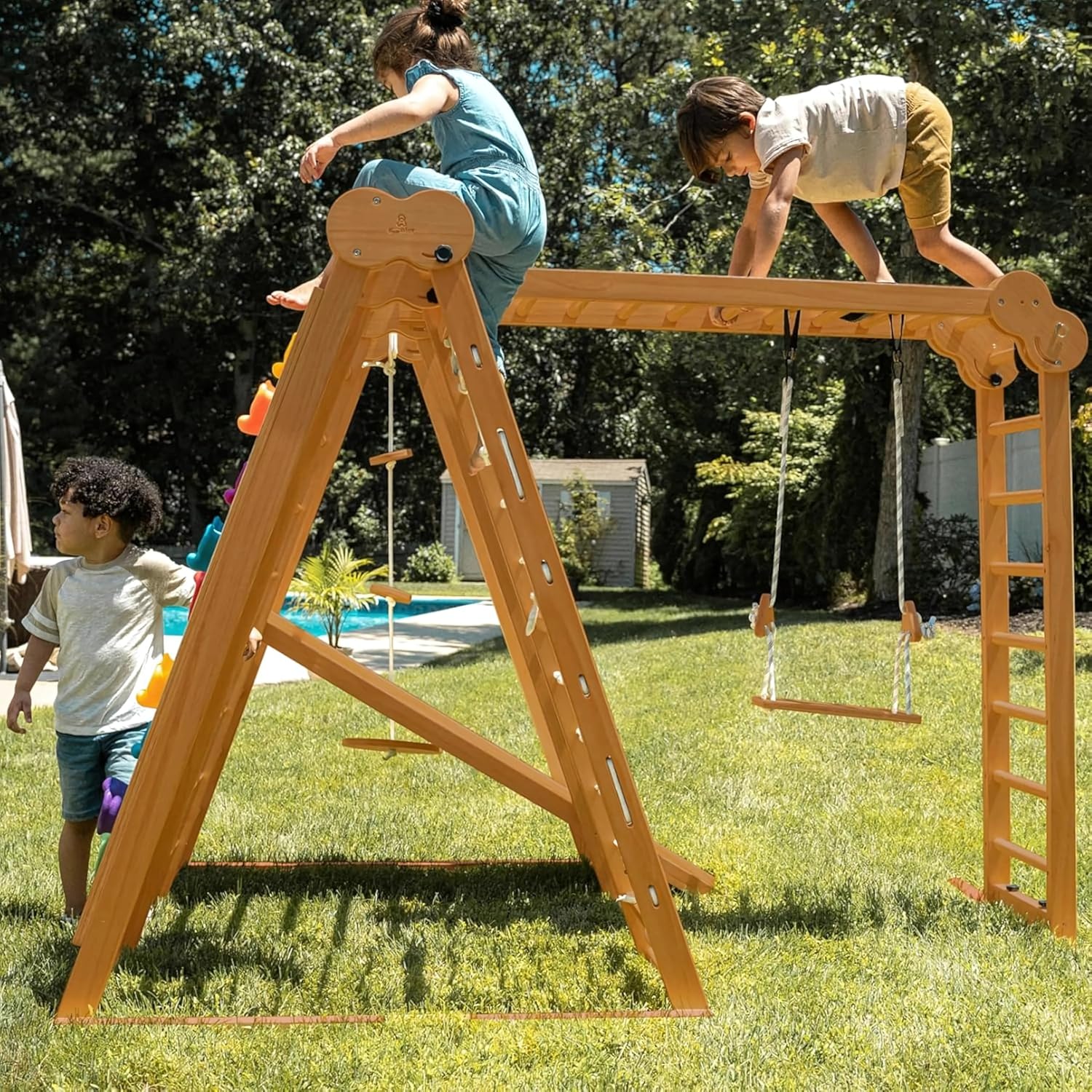 Natural wood 8-in-1 playset with slide, monkey bars, two swings, rock climbing wall, and gym rings for toddlers — view 2