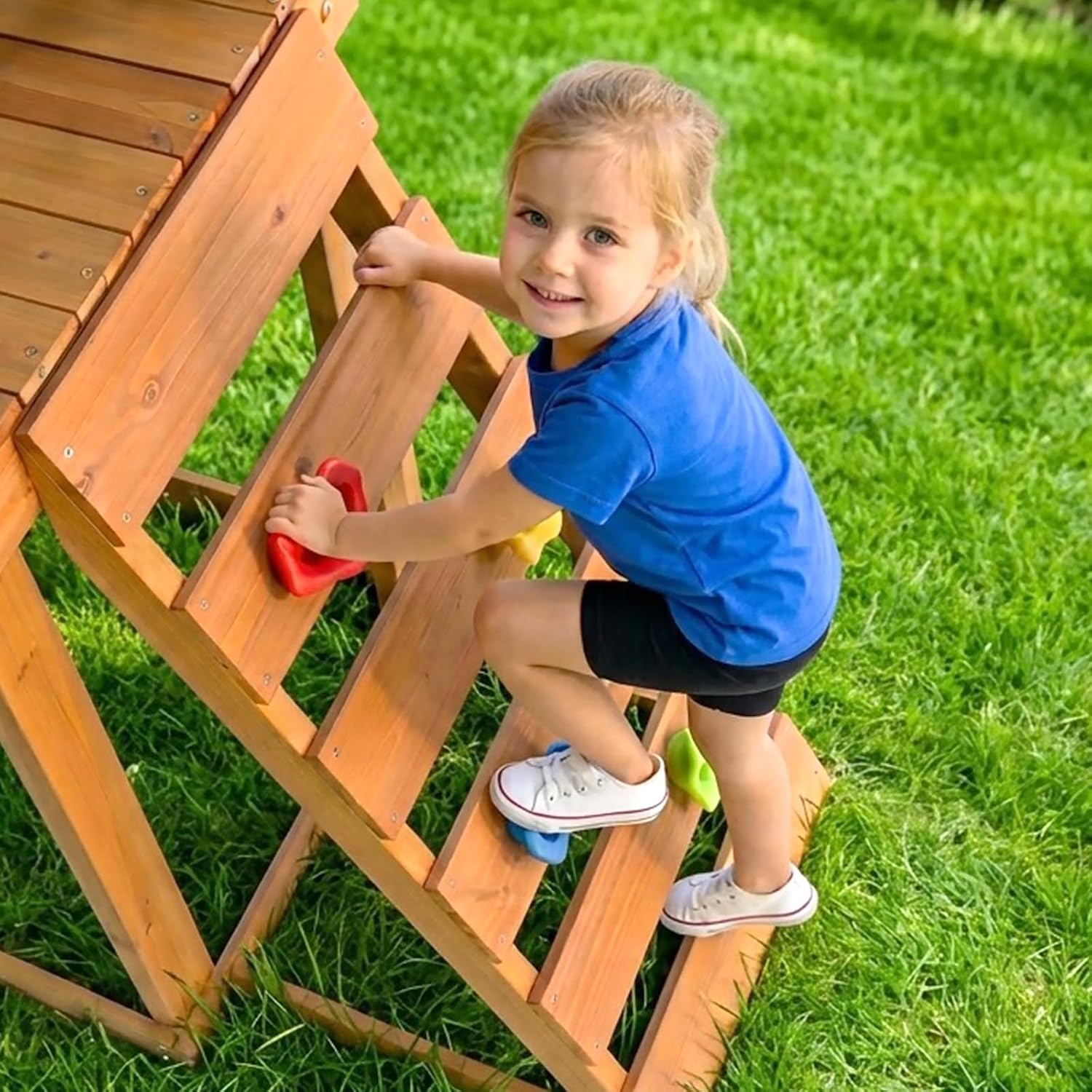 Wooden swing set with canopy featuring two belt swings, wave slide, monkey bars, climbing ladder, and rock wall for backyard play — view 4
