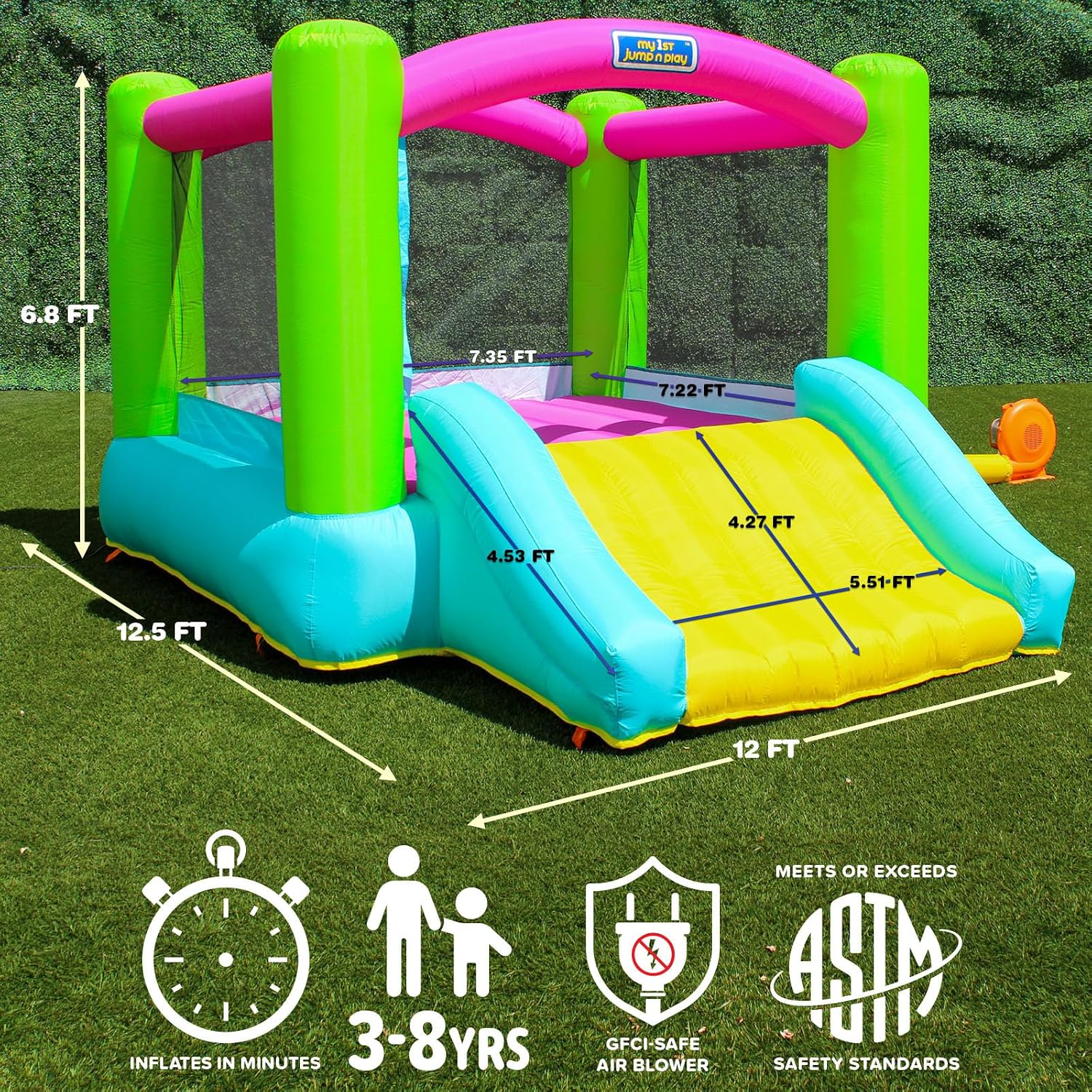Inflatable bounce house with attached slide in bright primary colors, featuring heavy-duty blower unit — view 2